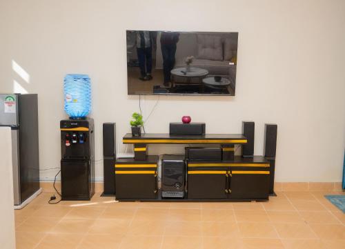Shared lounge/TV area, MJ Executive Homes in Eldoret