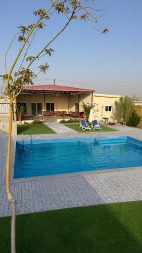 Rest house between the desert with a private pool – khách sạn tại Remah