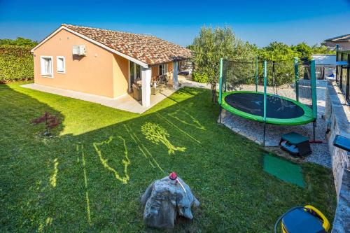 Holiday House Nives with pool and playground in Orihi