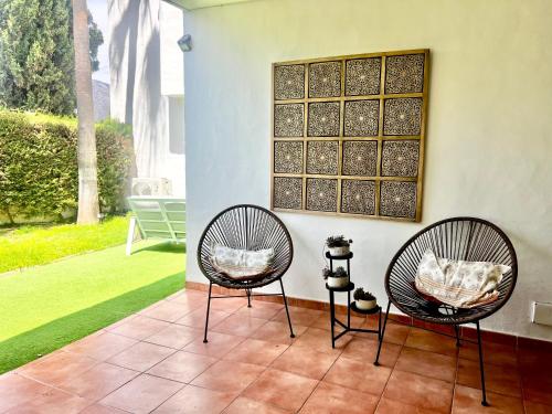Impeccable large apartment with immense terrace and private garden overlooking the mountain, featuring 2 bedrooms and sleeping up to 4 guests located 100 meters from Plaza Maestranza