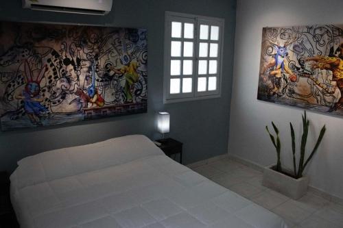 Calli Tochtli Dreaming Among Alebrijes in Sta Lucia