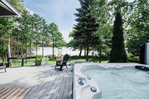Lakefront Luxe Hideaway with Hot tub in Hayes Township