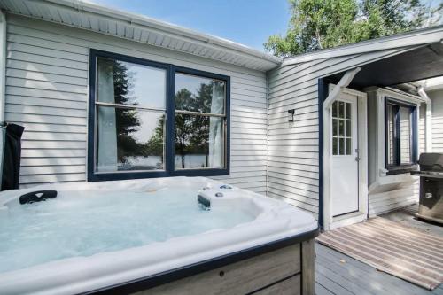 Lakefront Luxe Hideaway with Hot tub in Hayes Township