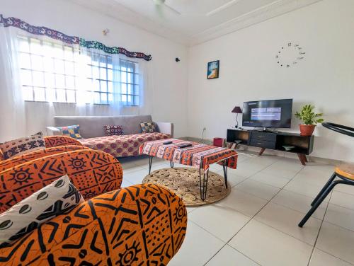 Petit Cocon de Ouidah - Chambre Cosy Climatisée - Plage a 10 min - Salon, Cuisine et balcon (Petit Cocon de Ouidah - Chambre Cosy Climatisee - Plage a 10 min - Salon, Cuisine et balcon) in Ouidah