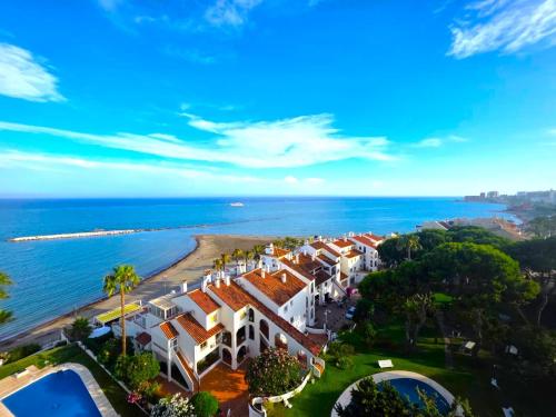 Apartamento en Benalmádena en la playa con piscina Frontal al mar