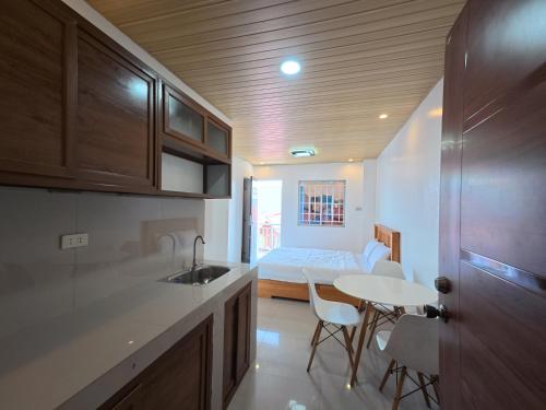 Kitchen, TravelNest Transient Inn Santa Rosa Laguna in Santa Rosa