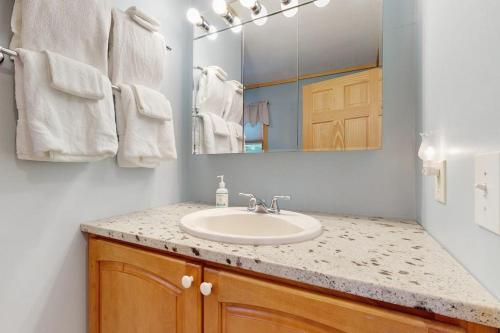 . Lakefront home with private dock, mooring, pebble beach, grill, & firepit