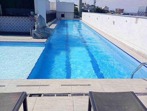 Swimming pool, Modern Apartment with Pool and Parking in Rio de Janeiro in Sao Francisco Xavier