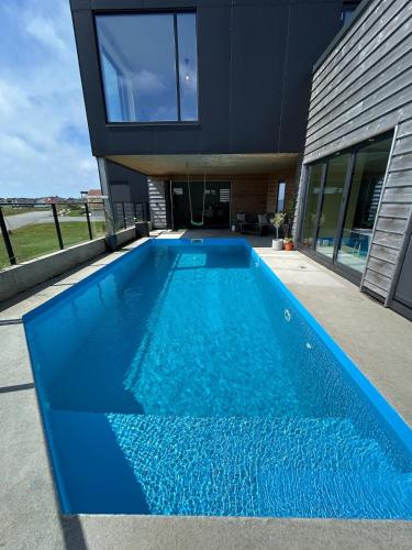 House with pool and steam bath on the beach! in Borhaug