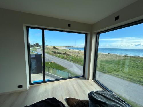 House with pool and steam bath on the beach! in Borhaug