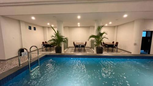 Swimming pool, Front One Hotel Mesir Surabaya near Warung Makan Makanan & Minuman