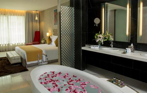 Bathroom, The Deltin Hotel in Daman