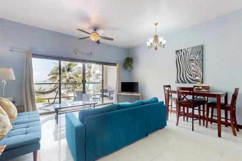 Beachfront condo with balcony sea view partial AC pool dock & kayaks in Ambergris Caye