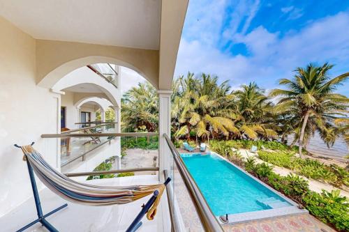 Beachfront condo with balcony sea view partial AC pool dock & kayaks in Ambergris Caye