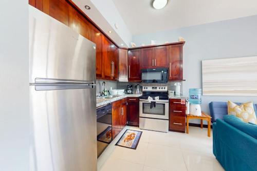 Beachfront condo with balcony sea view partial AC pool dock & kayaks in Ambergris Caye