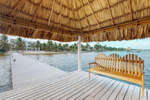 Beachfront condo with balcony sea view partial AC pool dock & kayaks in Ambergris Caye