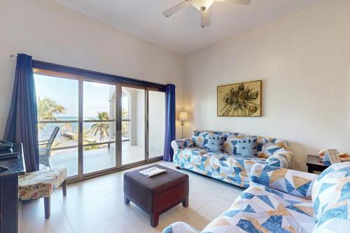 Serene oceanfront condo with shared pool ocean view WiFi & partial AC in Ambergris Caye