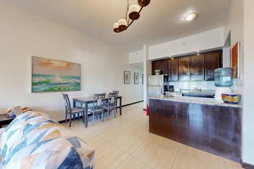 Serene oceanfront condo with shared pool ocean view WiFi & partial AC in Ambergris Caye