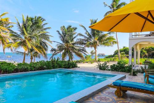 Serene oceanfront condo with shared pool ocean view WiFi & partial AC in Ambergris Caye