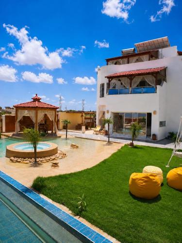 Luxury Beachfront Villa with Pool and Jacuzzi in 埃扎拉(本阿魯斯)