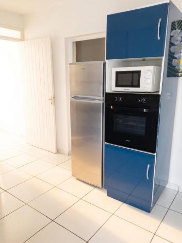 ห้องครัว, Maison confortable à Le Moule avec piscine partagée (Maison confortable a Le Moule avec piscine partagee) in เลอ มูล์