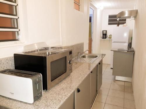 ห้องครัว, Appartement charmant à Sainte-Rose de 40 m² avec piscine (Appartement charmant a Sainte-Rose de 40 m² avec piscine) in ซานต์ โรเซ