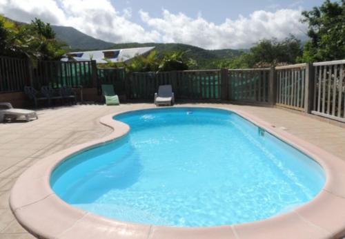 Cảnh quan, Chalet charmant à Bouillante avec piscine partagée (Chalet charmant a Bouillante avec piscine partagee) in Bouillante