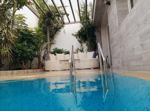 수영장, Villa Harmonie - Suite Familiale avec Piscine in 아인 조라