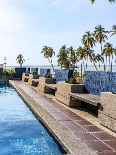 Swimming pool, Hotel Puerto Playa Suites in Lecheria