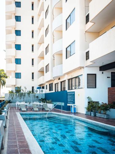 Swimming pool, Hotel Puerto Playa Suites in Lecheria