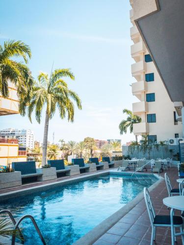 Swimming pool, Hotel Puerto Playa Suites in Lecheria