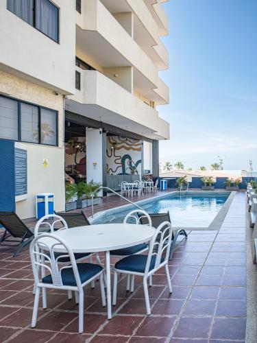 Swimming pool, Hotel Puerto Playa Suites in Lecheria