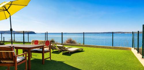 Garden, Apartments Nicolas - Beach & Sea 10m away - Amazing sea view! in Rtina