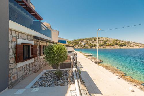 Exterior view, Villa Venetta,beach house,pool,jacuzzi,satellite internet-WiFi,4x4 UTV vehicle,SUP board,Island Zirj in Zirje