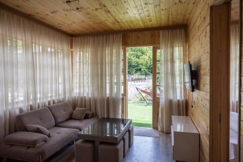 Κοινόχρηστο σαλόνι/χώρος τηλεόρασης, Laguna Villa Cottages in Acharistskali