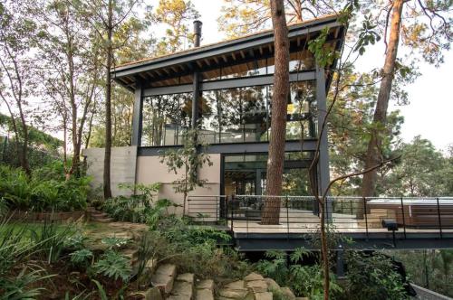 Architectural glass masterpiece villa in Avandaro Forest