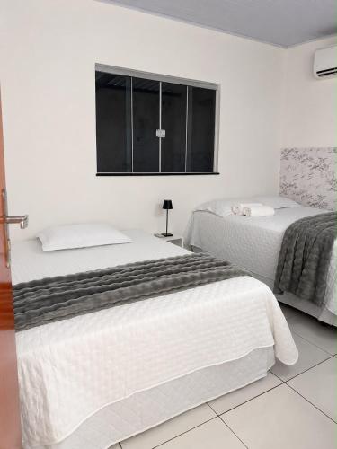 Casa com dois quartos e piscina em mineiros in Mineiros