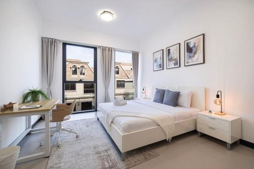 Chic 1BR in JVC Pool, Gym & Rooftop Views, Dubaj