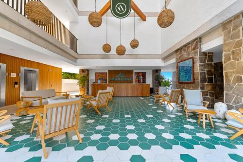 1BR Bucerías condo with pool, gym, balcony, WiFi, and beach views.