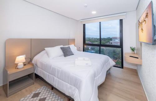 Cozy Central Stay Near Top Malls with Pool and Gym