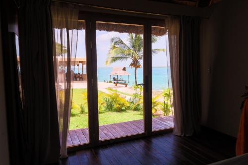 View, GlampCalar lagoon Front Bungalows in Bacalar