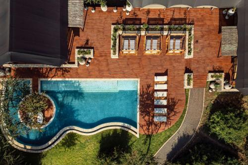 Swimming pool, JW Marriott Mount Kenya Rhino Reserve Safari Camp in Mweiga