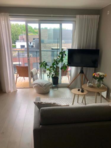 Bright, stylish apartment with a sunny balcony close to nature