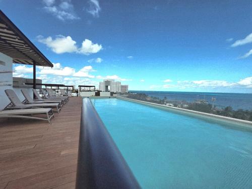 Condo across de beach, Rooftop, Pool, Great location, Takh
