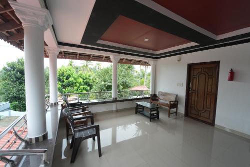 شرفة/ تراس, Wayanad Palm Grove Retreat 1st Floor in Kolagapaara