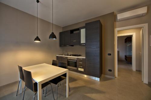 Kitchen, Lepini Suites in Patrica