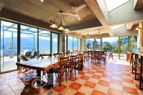 a dining room with tables and chairs and a large window, Moose & Squirrel in Nantou