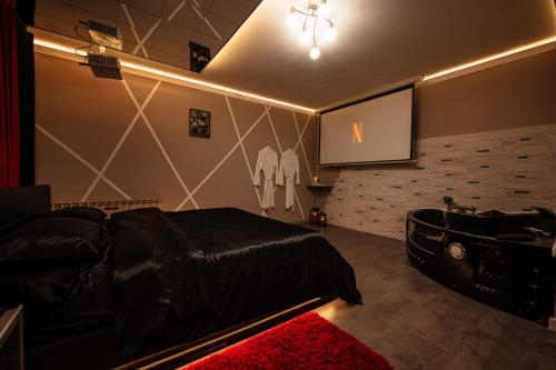 Suite O'Dream - Jacuzzi - Cinéma - Climatisation - Location saisonnière - Fleury-les-Aubrais