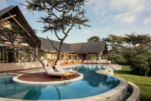Swimming pool, JW Marriott Mount Kenya Rhino Reserve Safari Camp in Mweiga