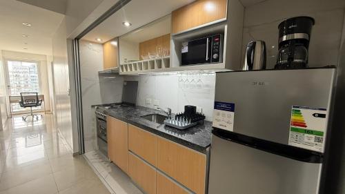 10th-floor apartment with a home desk and gym